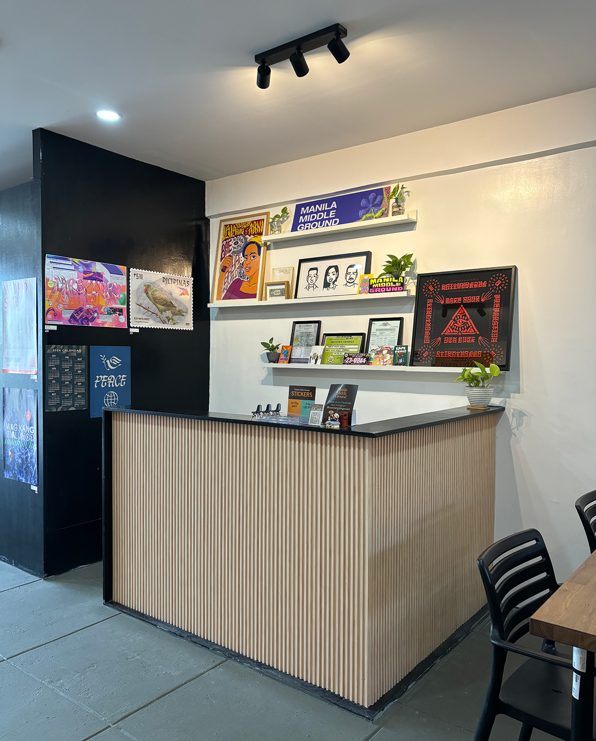 Manila Middle Ground counter and reception area with art displays